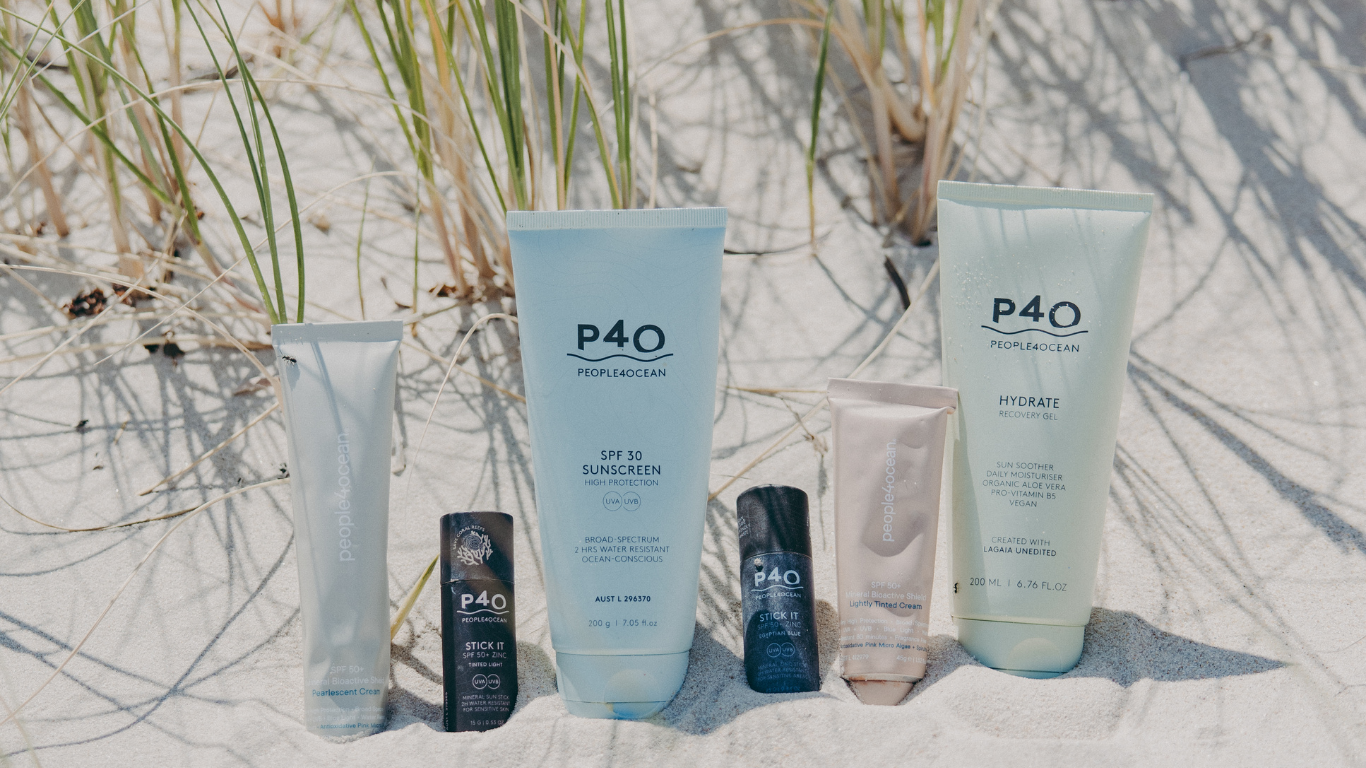 People4ocean sunscreen and skincare products displayed on sand